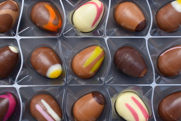 Selection of filled fresh chocolates Smooth pralines with pistachios and macadamia nuts vanilla strawberry raspberry flavours salted caramel and boozy simnel cake Modern traditions to celebrate Easter