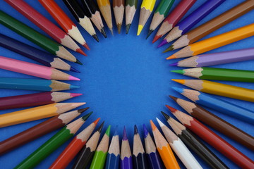 Fototapeta premium multicolored pencils on a colored background