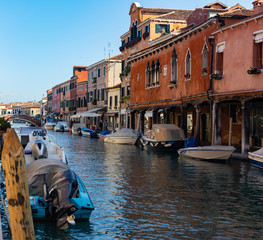 canals in venice with gondolas early in the morning