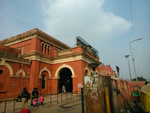 Low Angle View Of Agra Fort Railway Station Against Cloudy Sky