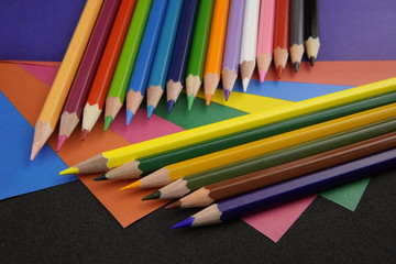 multicolored pencils on a colored background