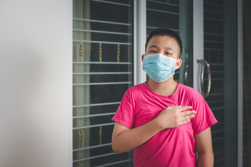 Asian children boy is wearing medical mask protection coronavirus COVID-19 or PM2.5. Concept health care.