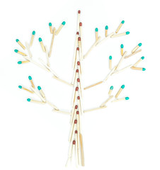 tree made of matched sticks on white background