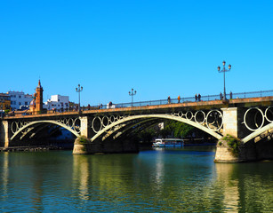Obraz na płótnie Canvas View of the Isabel II Bridge (popularly called Puente de Triana) in Seville, Spain.