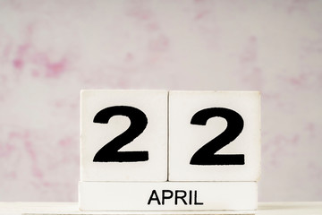 White cube calendar for April with copy space