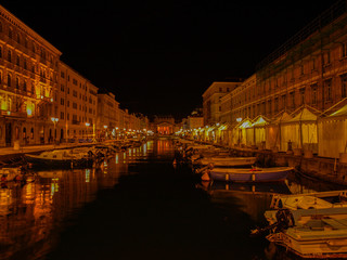 Fototapeta na wymiar Canal Grande in Trieste, Italy, at night