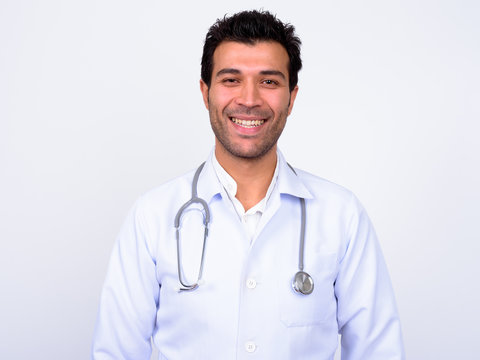 Handsome Turkish man doctor against white background