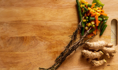 Board, knife, chopped vegetables, rosemary