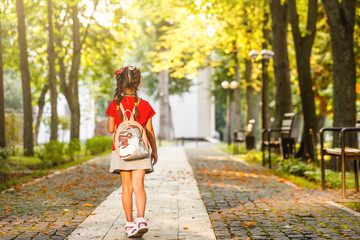 schoolgirl going to school alone