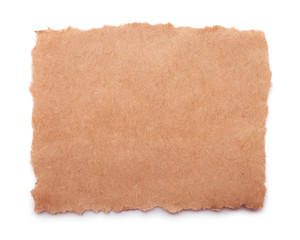 Torn craft paper isolated on white background. Brown paper texture with place for text, top view