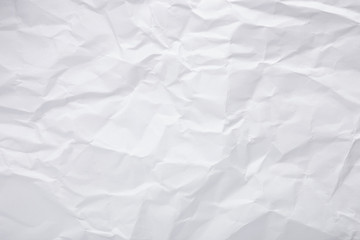 White crumpled paper texture as background. Copy space text