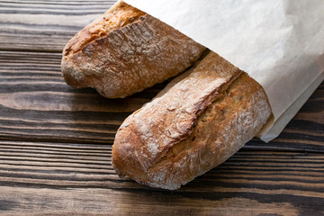 French baguettes. Bread on wooden board.