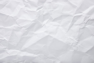 White crumpled paper texture as background. Copy space text