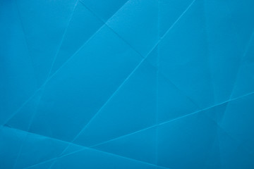Blue crumpled paper texture as background. Copy space text