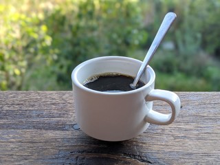 Cup of coffee on wooden table in costa rica