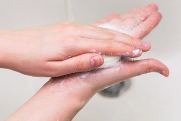 Personal hygiene, prevention of diseases and infections. Hand washing with soap and water to prevent coronavirus.