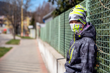 Kid with face mask in city