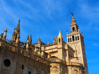 Fototapeta na wymiar View of the Giralda in Seville, Spain. It is the bell tower of the Cathedral of Saint Mary of the See in Seville, Andalusia, Spain.