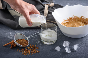 Cooking step-by-step Korean Dalgona coffee. Pour the first layer of milk and ice. Step 3.