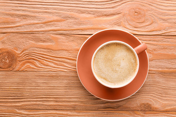 Cup of tasty cappuccino on wooden background