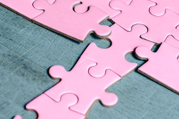 the unexpected solution.
purple jigsaw/puzzle with a row in wrong position, on blue background,...