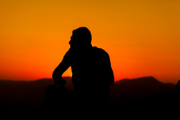 silhouette of man at sunset