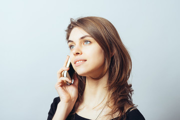 funny cute brunette girl talking on a cell phone