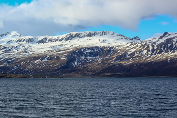 snow-covered majestic mountains near the ocean. The Landscape Of Iceland