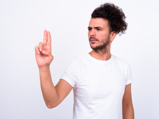 Naklejka premium Portrait of handsome bearded Turkish man touching something