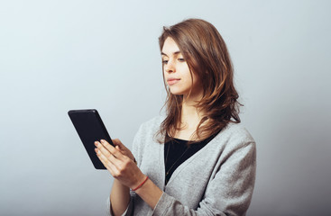 Fototapeta premium young woman using digital tablet computer