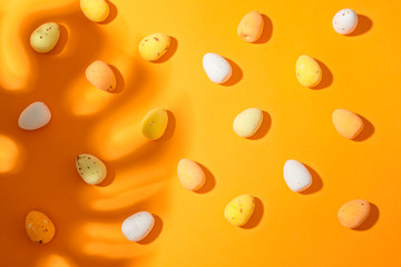 Easter eggs on the orange background closeup copy spase