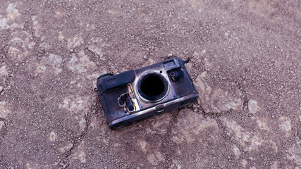 Old camera after a fire. The concept of fire.