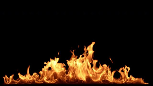 Fire Flames burning in the dark. 4K motion background. 3d rendering. Seamless loopable animation.