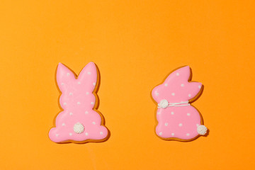 Easter bunny cookies on the orange background