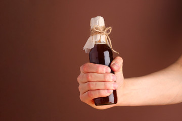 cold brew it bottle in man hand. barista and cold brew coffee