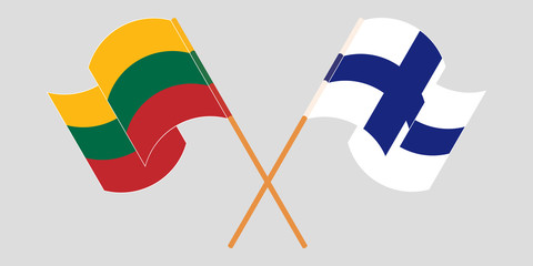 Crossed and waving flags of Lithuania and Finland