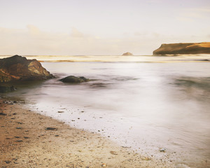 Fototapeta na wymiar Calm sea at Polzeath, Cornwall, England