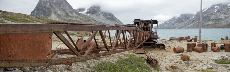 Fototapeta premium An abandoned military crane sits as rust takes over its chassis. 