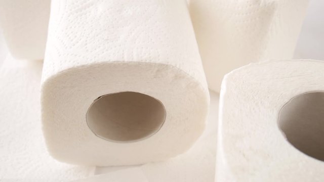 Rolls of toilet paper on the table.