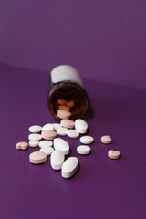 high angle view of colorful pills on color background 
