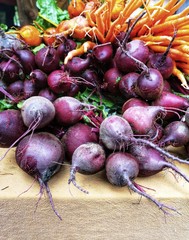 Beetroots and carrots at a farmer's market.