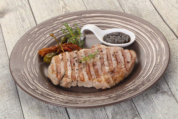 Grilled pork steak with pepper sauce