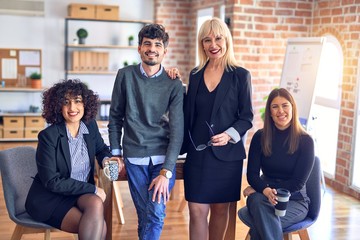 Group of business workers smiling happy and confident. Posing together with smile on face looking at the camera at the office