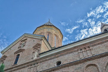 Obraz premium Temple of the Georgian Orthodox Church on a background of blue sky