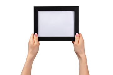 Female hands holding photo frame with copy space isolated on white