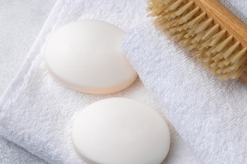 Obraz na płótnie Canvas Bar of natural handmade soap, towel and spa objects, close up