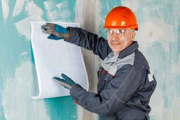 A person is an engineer, architect and inspector who works on a construction site to monitor, plan...