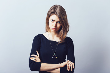 Closeup portrait displeased pissed off angry grumpy pessimistic woman with bad attitude, arms...
