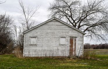 weathered wooden farm building