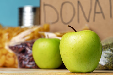 Food donations on the table. Text Donation. Close up.